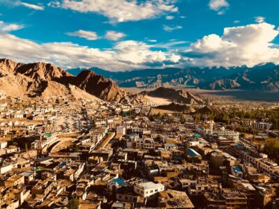 white clouds in blue sky over houses